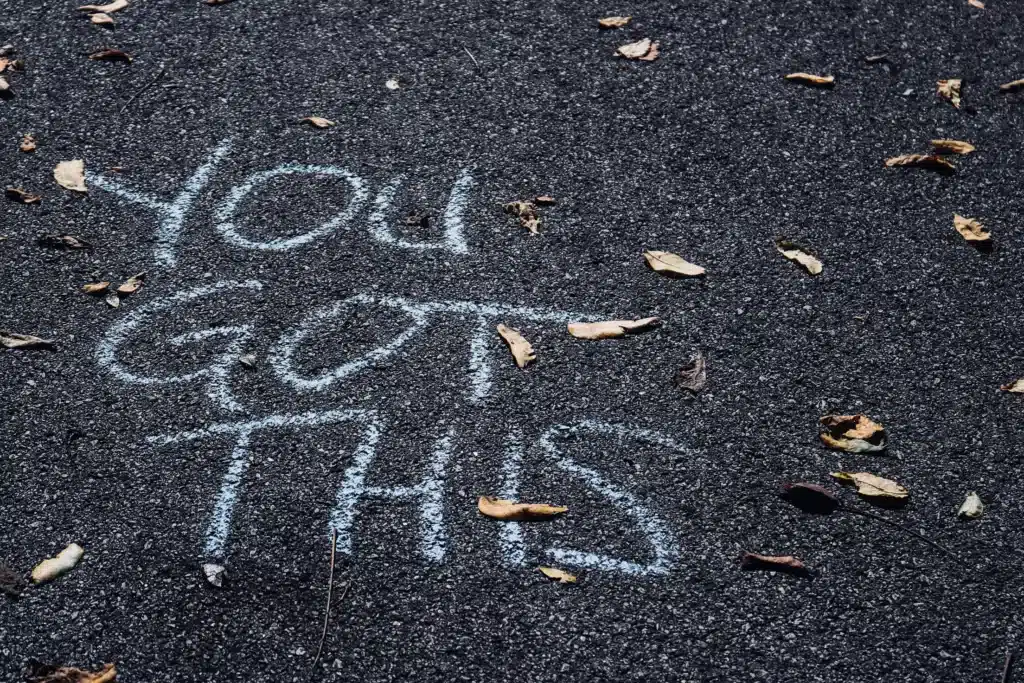 Chalk on sidewalk written "You Got This". Managing ADHD Symptoms. Coaching for ADHD.